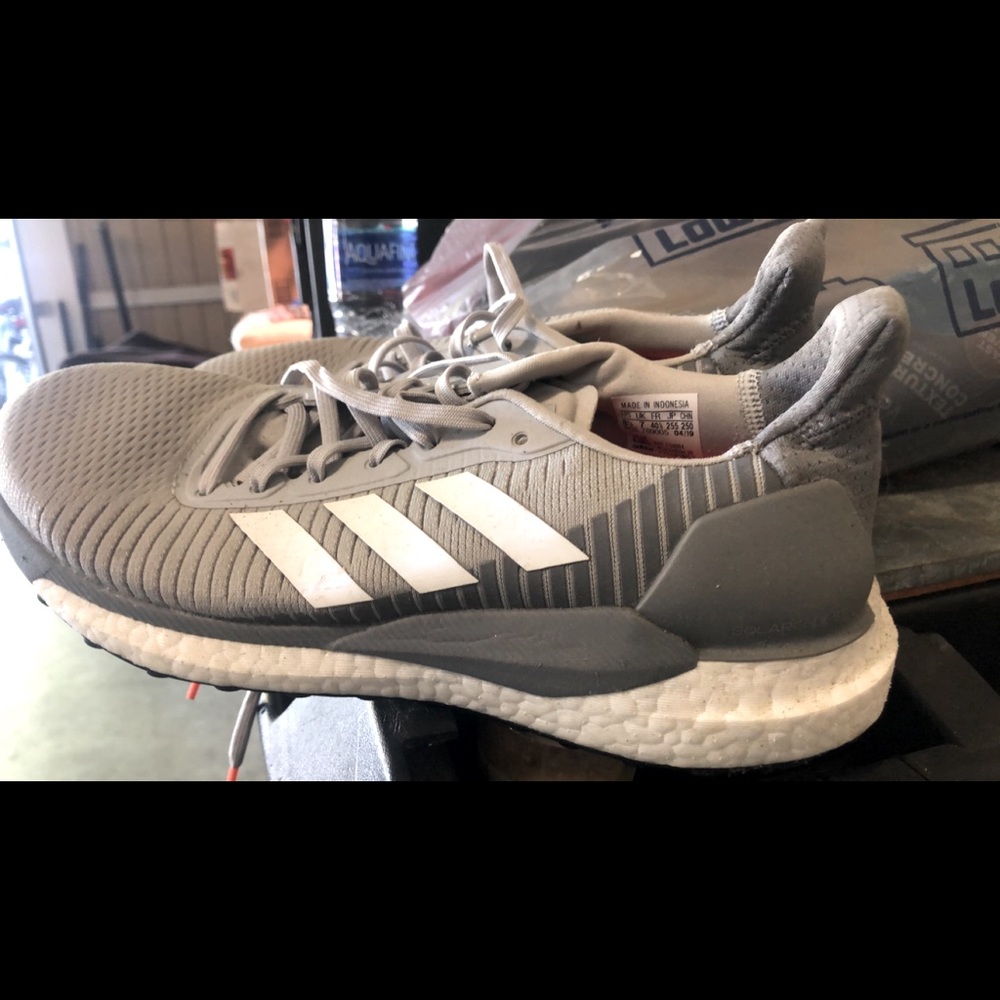 Adidas grey tennis shoes. Worn a couple times